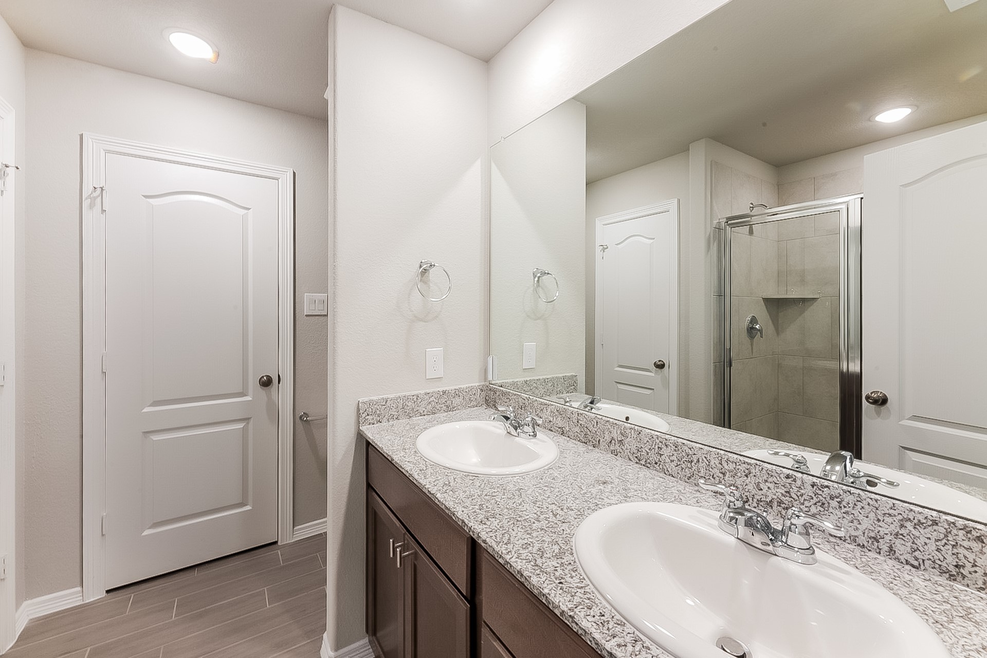 25542 Valverdant Court Porter, TX 77365 - Photo 13 of 17 a bathroom with a granite countertop sink and a mirror