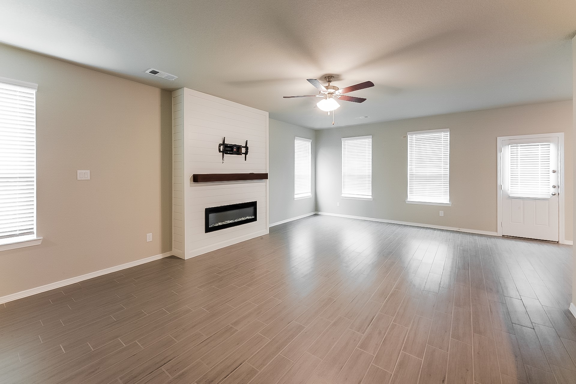 25542 Valverdant Court Porter, TX 77365 - Photo 5 of 17 a view of an empty room with window and wooden floor