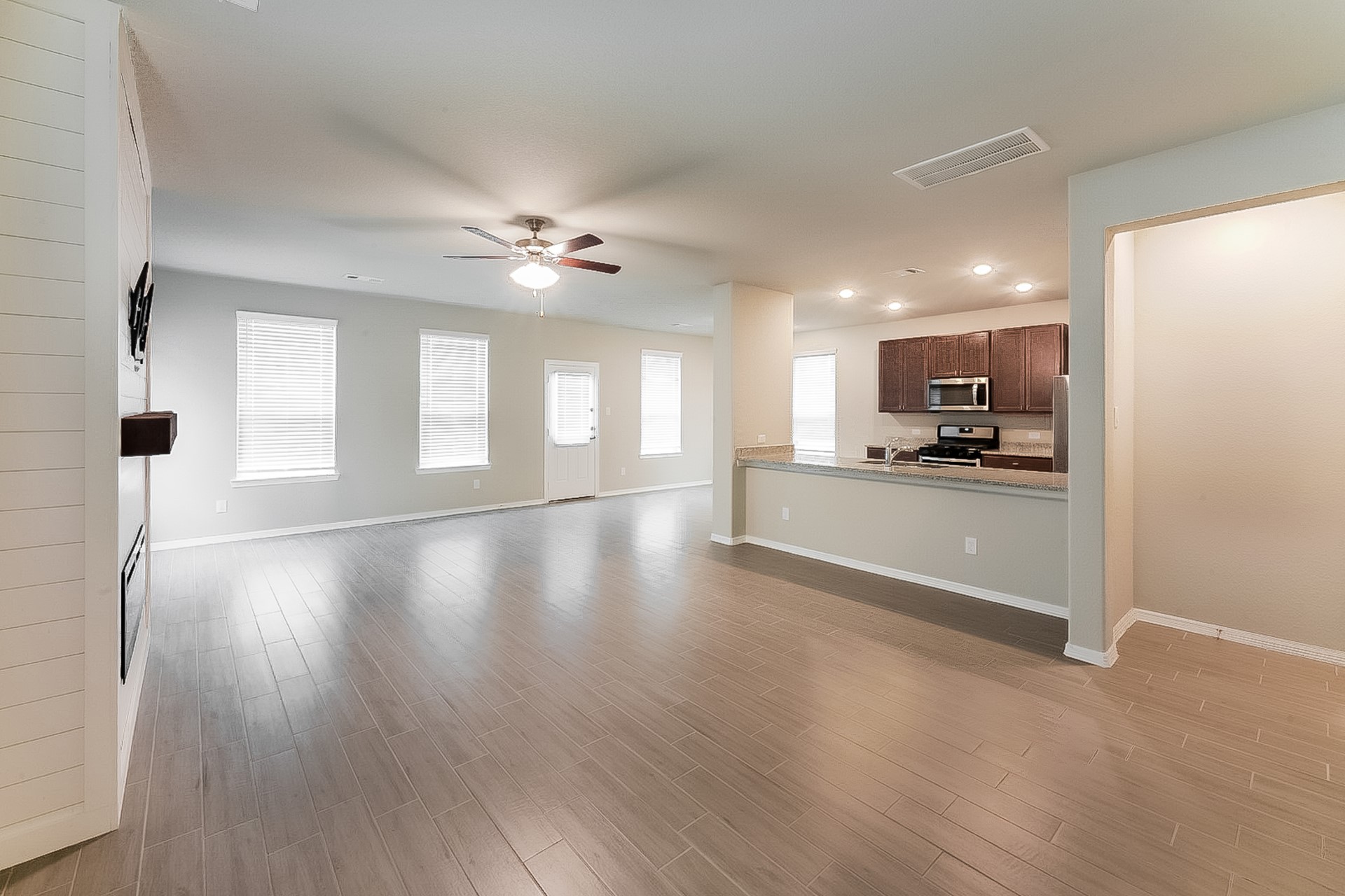 25542 Valverdant Court Porter, TX 77365 - Photo 7 of 17 a view of a kitchen with a sink and a stove top oven