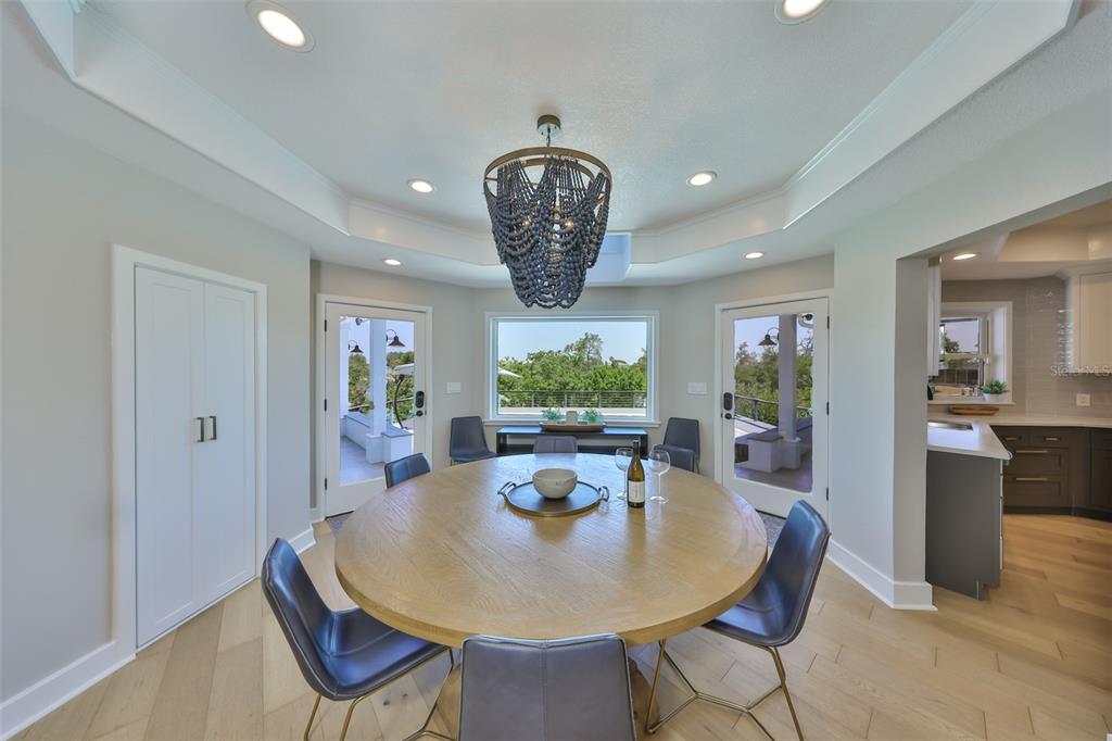 945 Bunker View Drive Apollo Beach, FL 33572 - Photo 24 of 92 a view of a dining room with furniture window and wooden floor