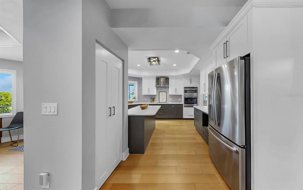 945 Bunker View Drive Apollo Beach, FL 33572 - Photo 25 of 92 a view of a kitchen with a refrigerator