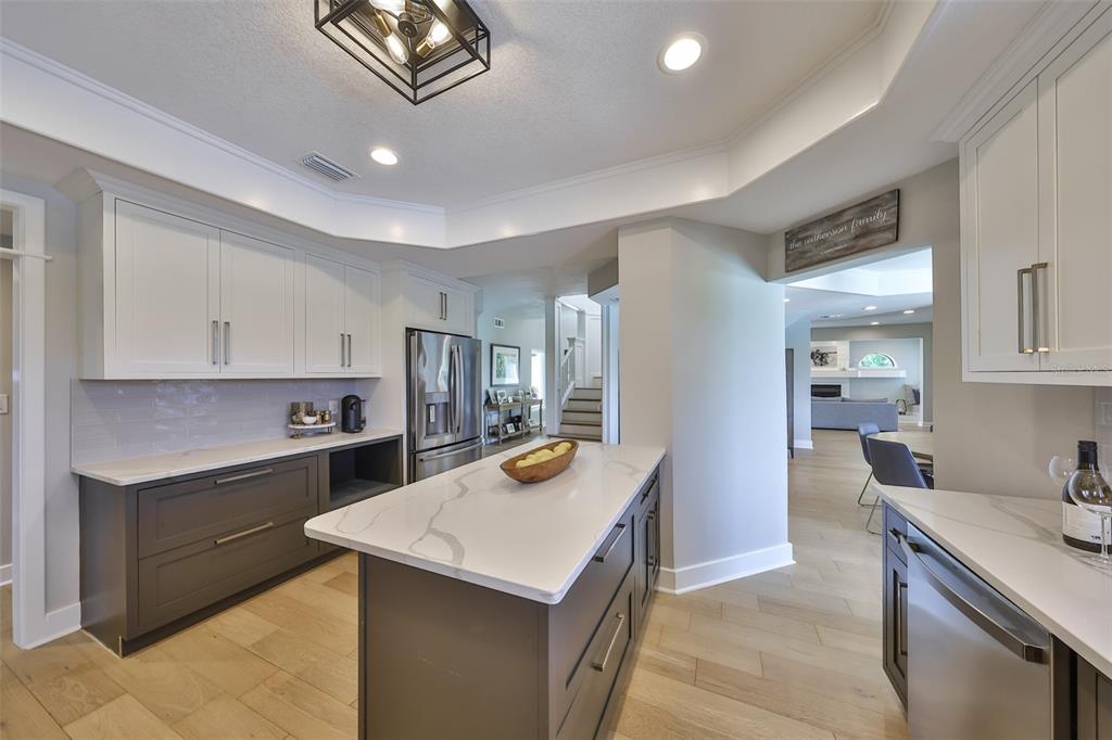 945 Bunker View Drive Apollo Beach, FL 33572 - Photo 29 of 92 a kitchen that has a sink and a stove in it