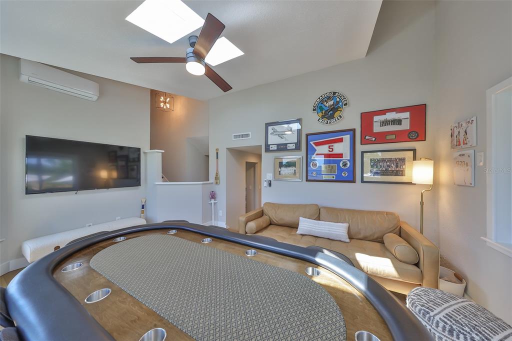 945 Bunker View Drive Apollo Beach, FL 33572 - Photo 35 of 92 a bedroom with a bed and a flat screen tv