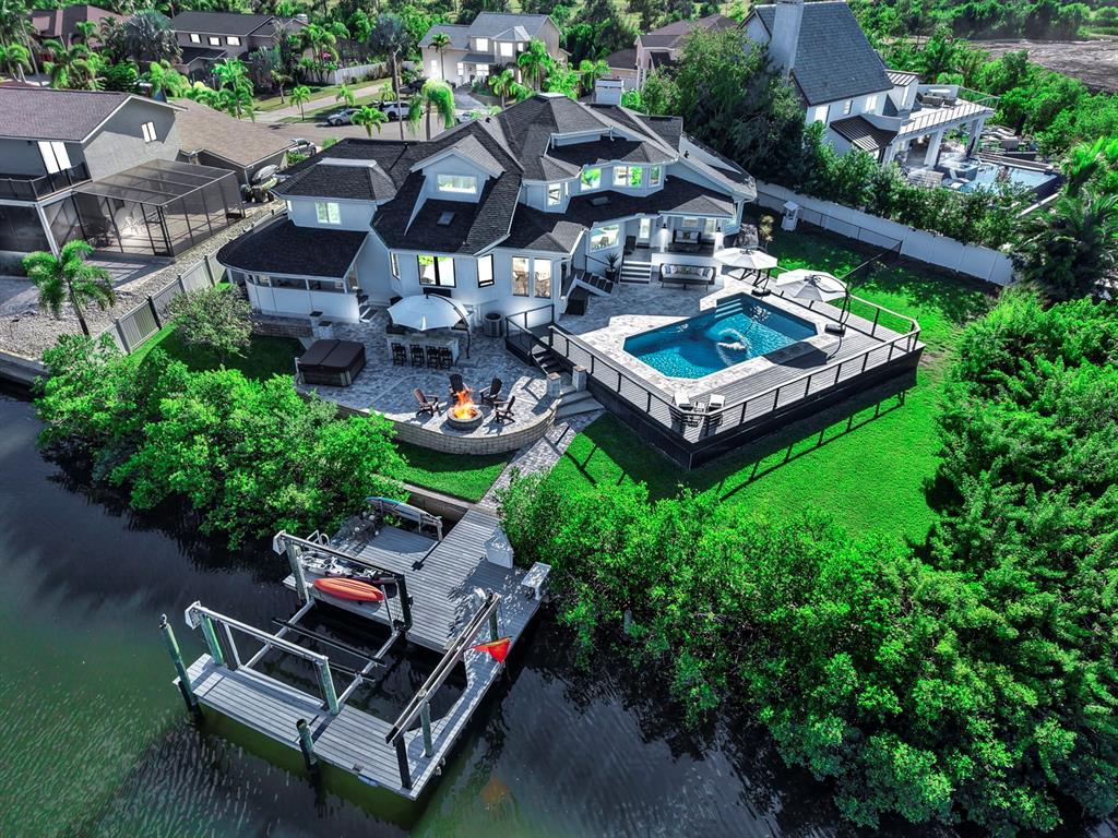 945 Bunker View Drive Apollo Beach, FL 33572 - Photo 4 of 92 an aerial view of a house with garden space and lake view