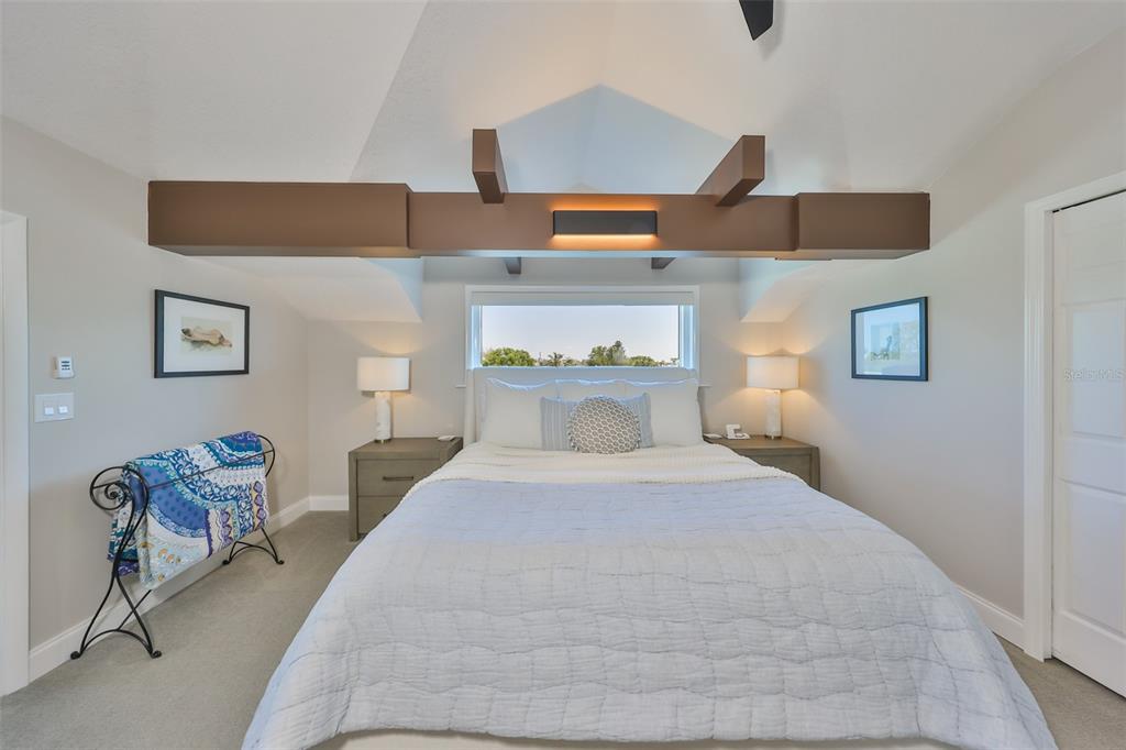 945 Bunker View Drive Apollo Beach, FL 33572 - Photo 43 of 92 a bedroom with a bed and wooden floor