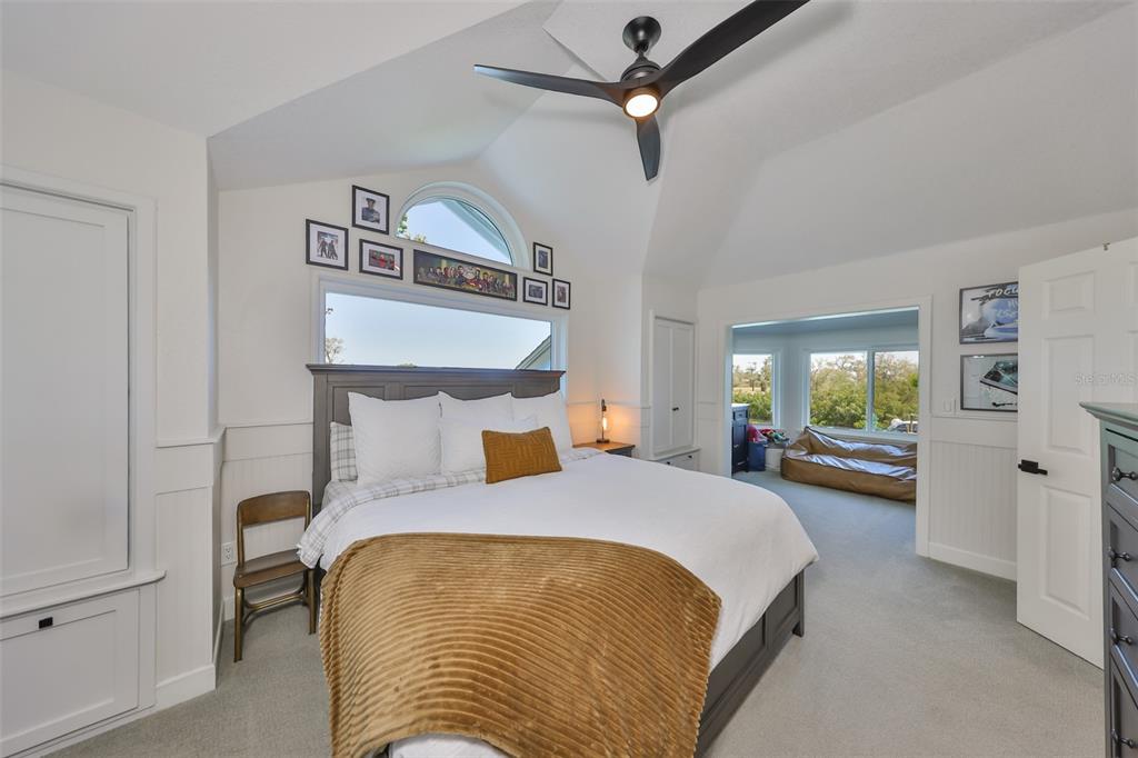 945 Bunker View Drive Apollo Beach, FL 33572 - Photo 56 of 92 a bedroom with a bed and ceiling fan
