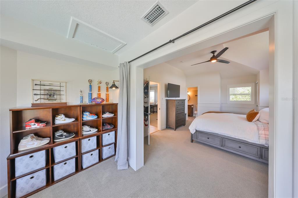 945 Bunker View Drive Apollo Beach, FL 33572 - Photo 58 of 92 a spacious bedroom with a bed and a window