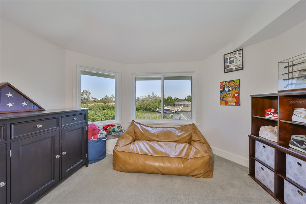 945 Bunker View Drive Apollo Beach, FL 33572 - Photo 59 of 92 a bed room with furniture and a window
