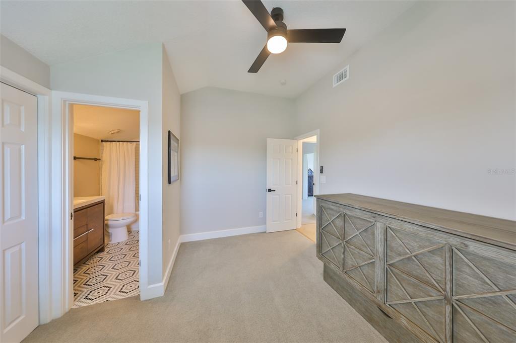 945 Bunker View Drive Apollo Beach, FL 33572 - Photo 62 of 92 a view of a livingroom with wooden floor and a ceiling fan