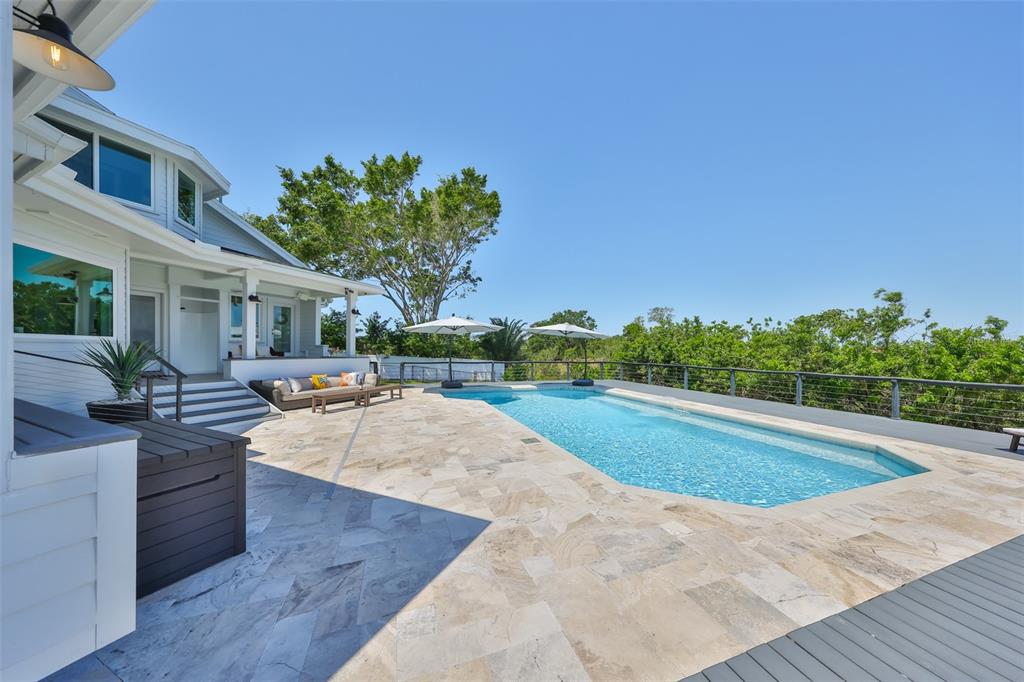 945 Bunker View Drive Apollo Beach, FL 33572 - Photo 68 of 92 a view of a swimming pool with lounge chair