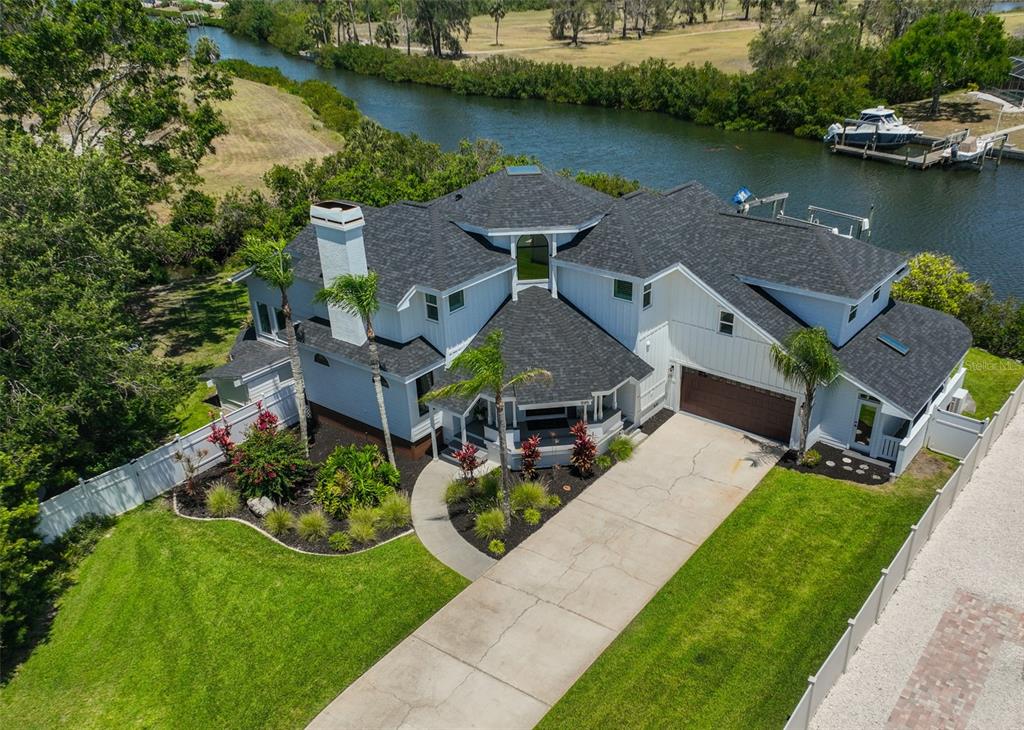 945 Bunker View Drive Apollo Beach, FL 33572 - Photo 89 of 92 an aerial view of a house with garden space and outdoor seating