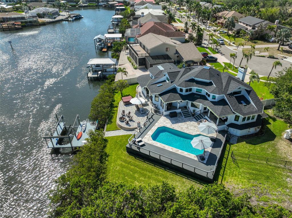 945 Bunker View Drive Apollo Beach, FL 33572 - Photo 9 of 92 an aerial view of a house with a garden and lake view