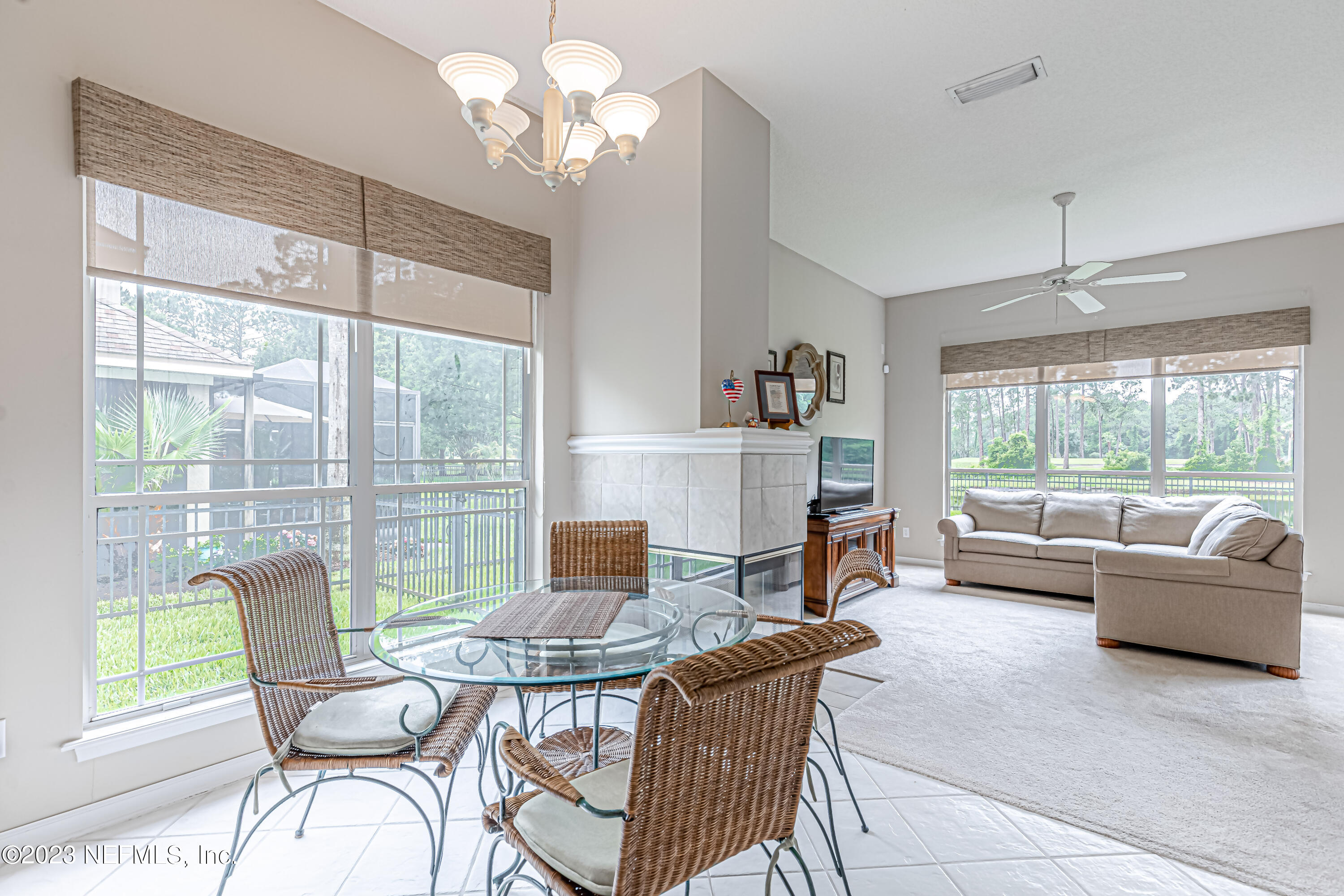 1614 Pinecrest Drive Fleming Island, FL 32003 - Photo 16 of 86 a living room with fireplace furniture and a large window