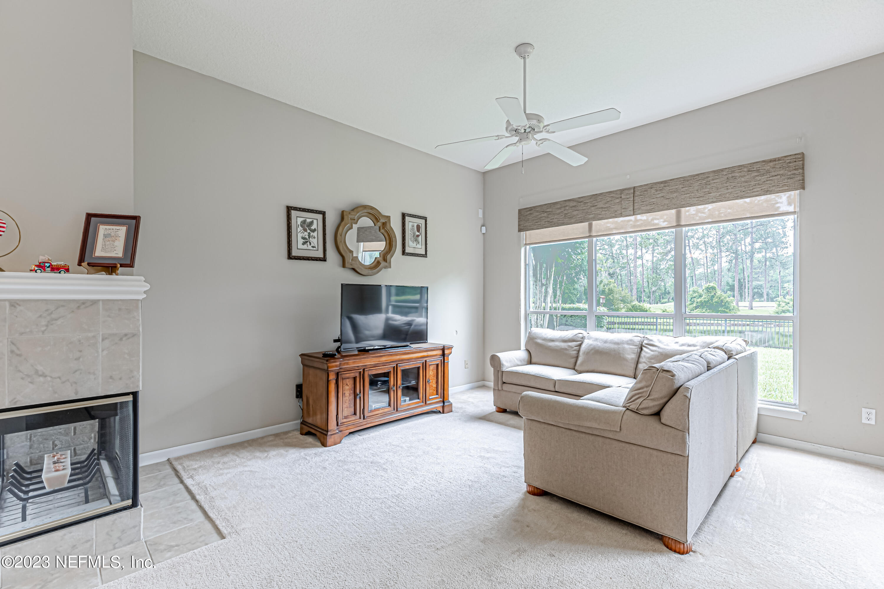 1614 Pinecrest Drive Fleming Island, FL 32003 - Photo 17 of 86 a living room with furniture and a fireplace
