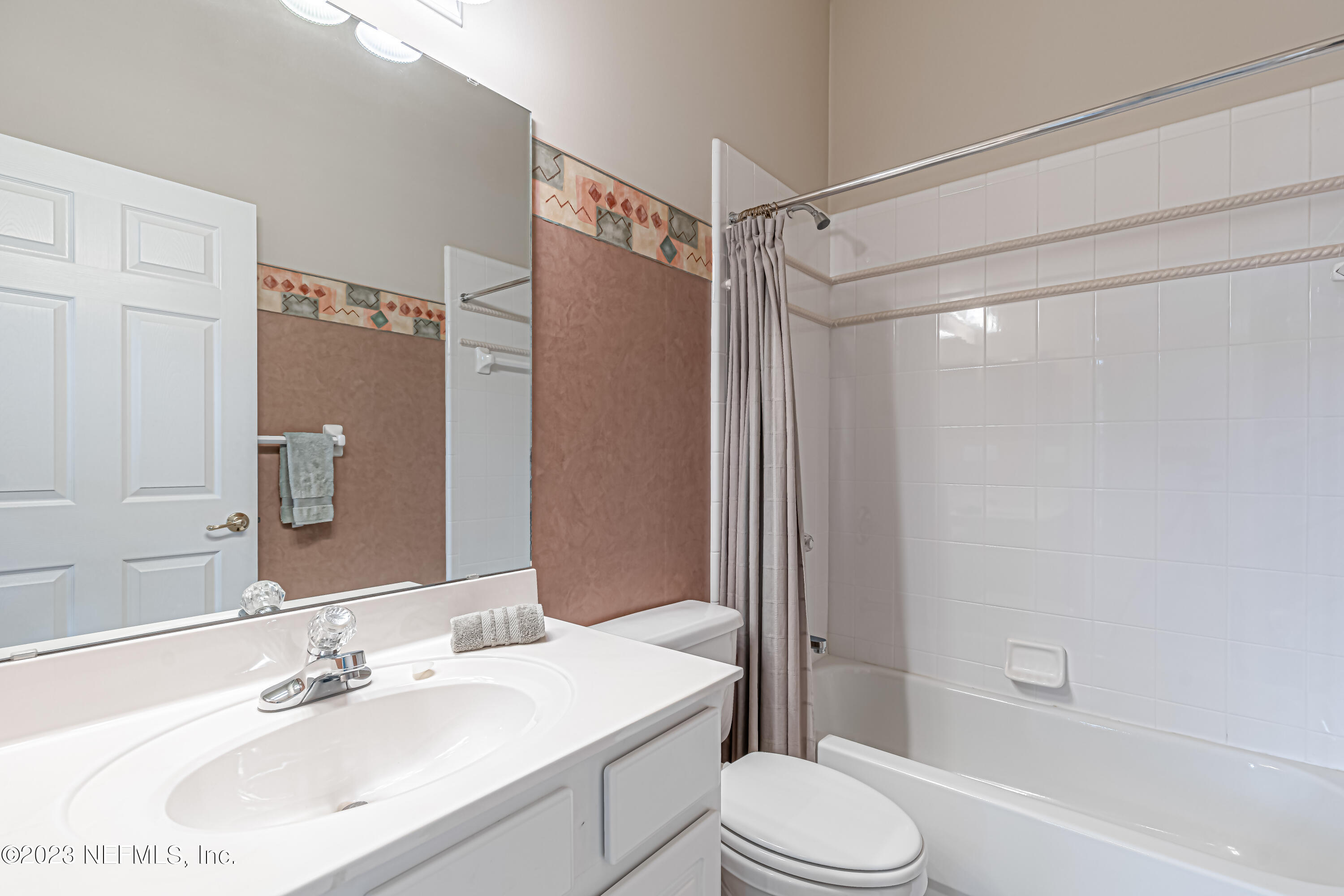1614 Pinecrest Drive Fleming Island, FL 32003 - Photo 21 of 86 a bathroom with a sink toilet and shower