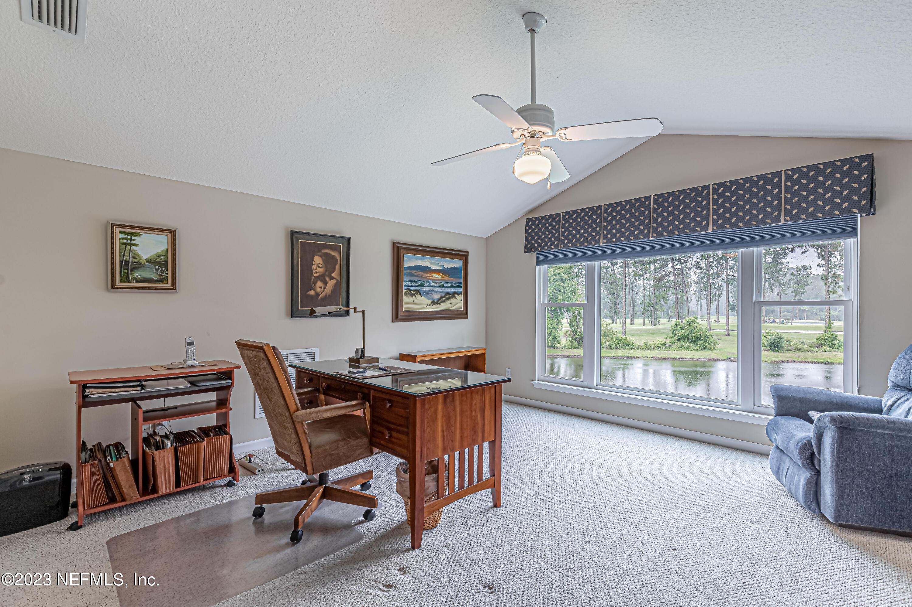 1614 Pinecrest Drive Fleming Island, FL 32003 - Photo 29 of 86 a dining room with furniture a chandelier and a rug