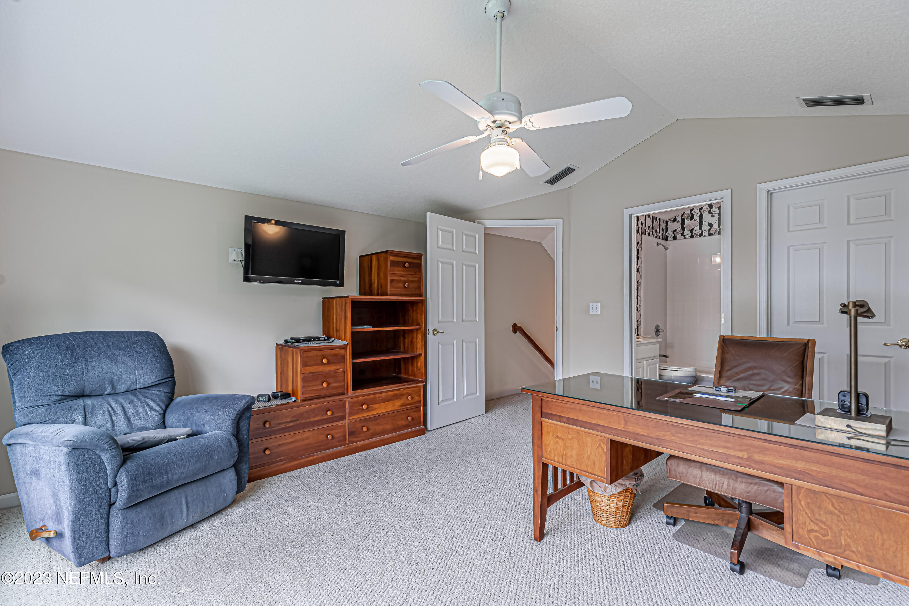 1614 Pinecrest Drive Fleming Island, FL 32003 - Photo 30 of 86 a living room with furniture and a flat screen tv