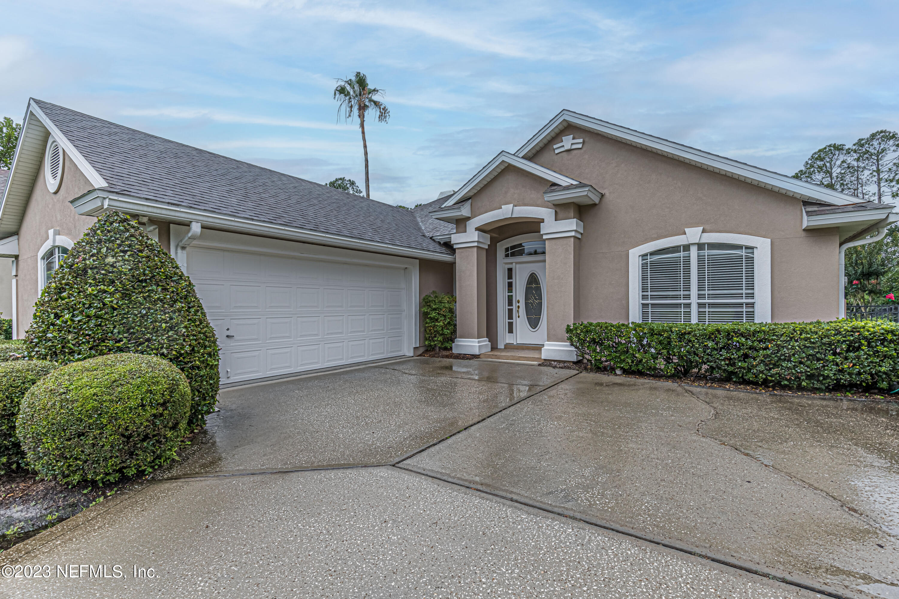 1614 Pinecrest Drive Fleming Island, FL 32003 - Photo 3 of 86 a front view of a house with a yard