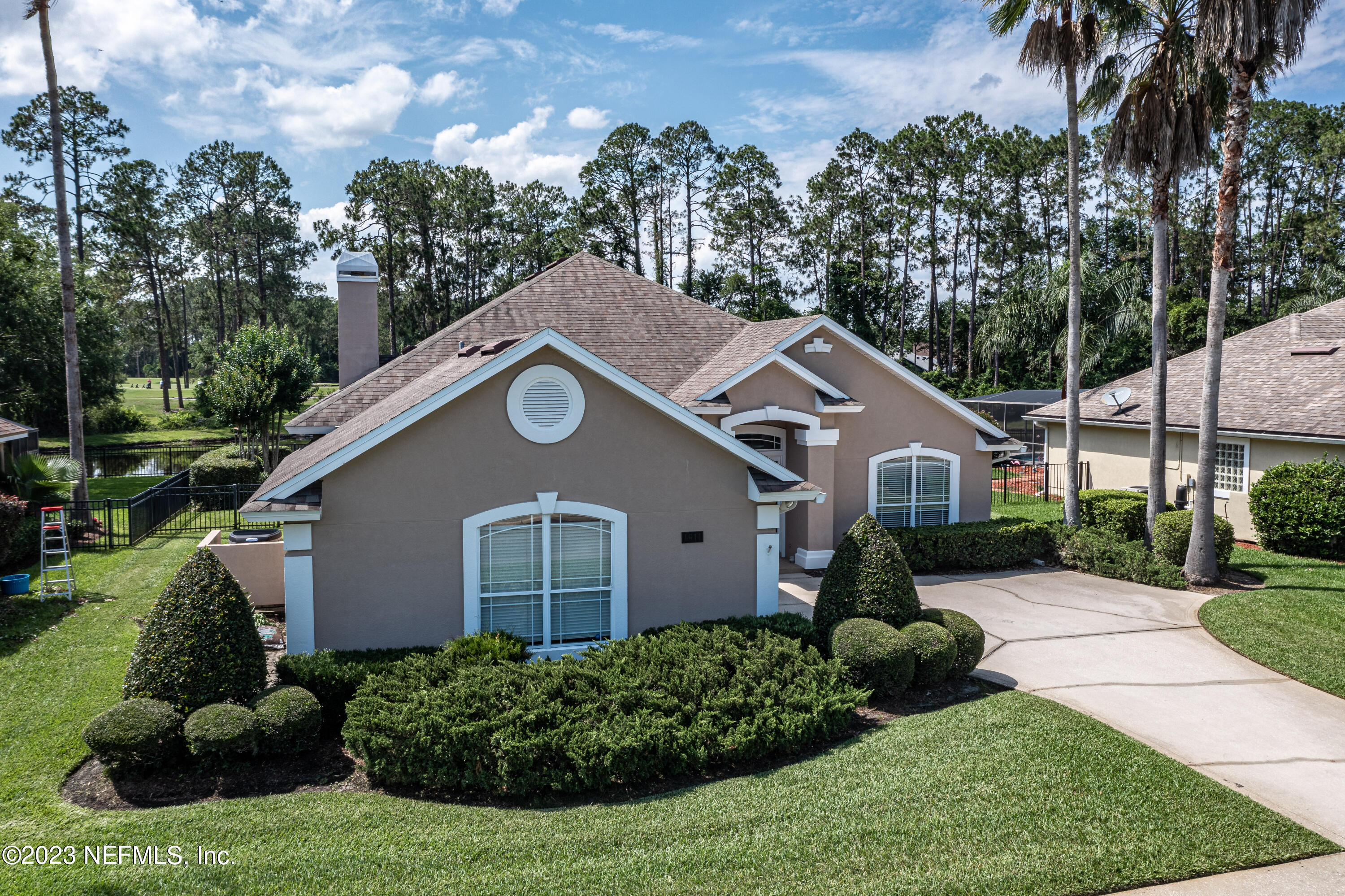1614 Pinecrest Drive Fleming Island, FL 32003 - Photo 34 of 86 a aerial view of a house with a yard and potted plants