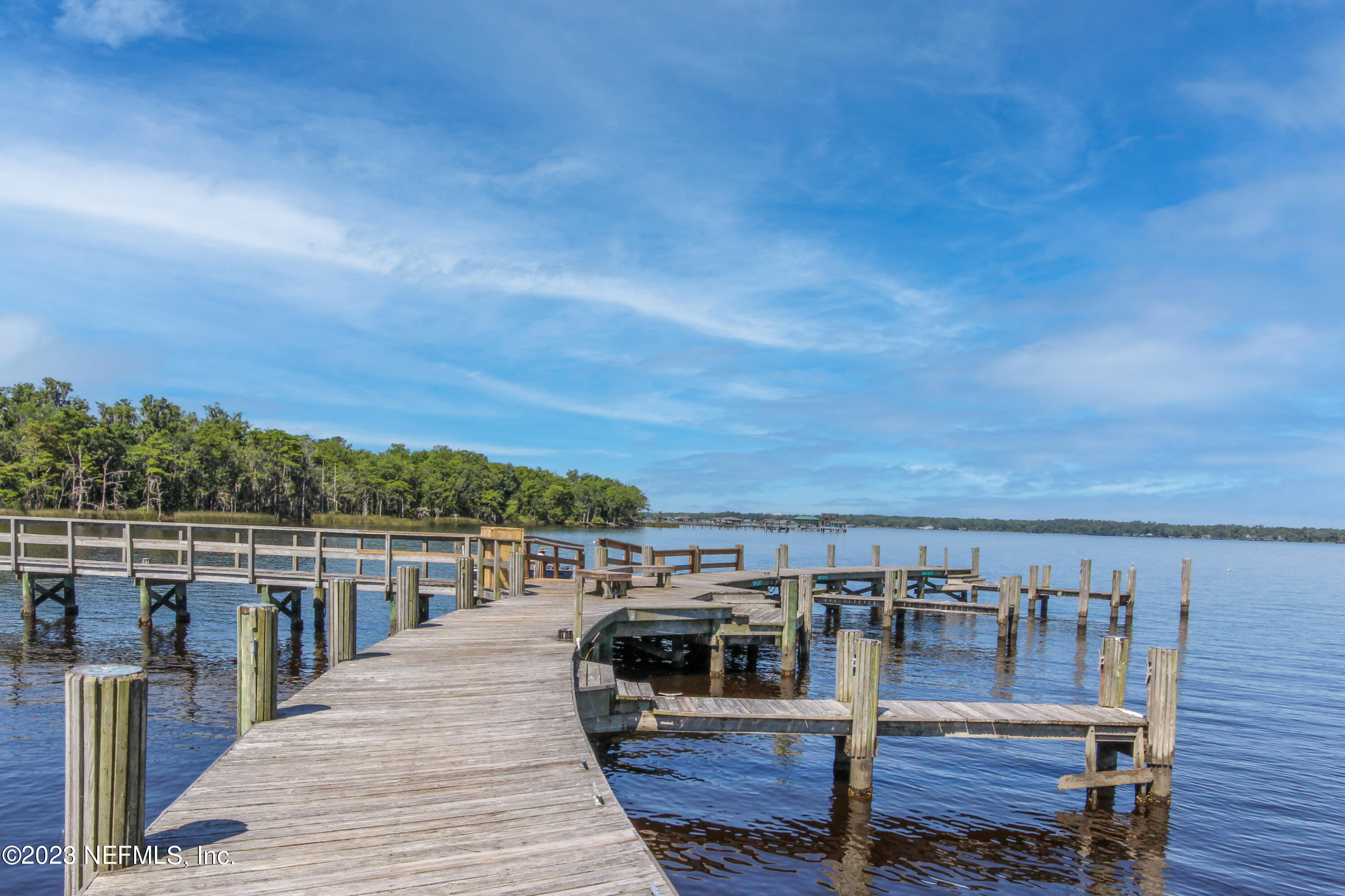 1614 Pinecrest Drive Fleming Island, FL 32003 - Photo 67 of 86 a view of roof deck with two chairs and wooden floor