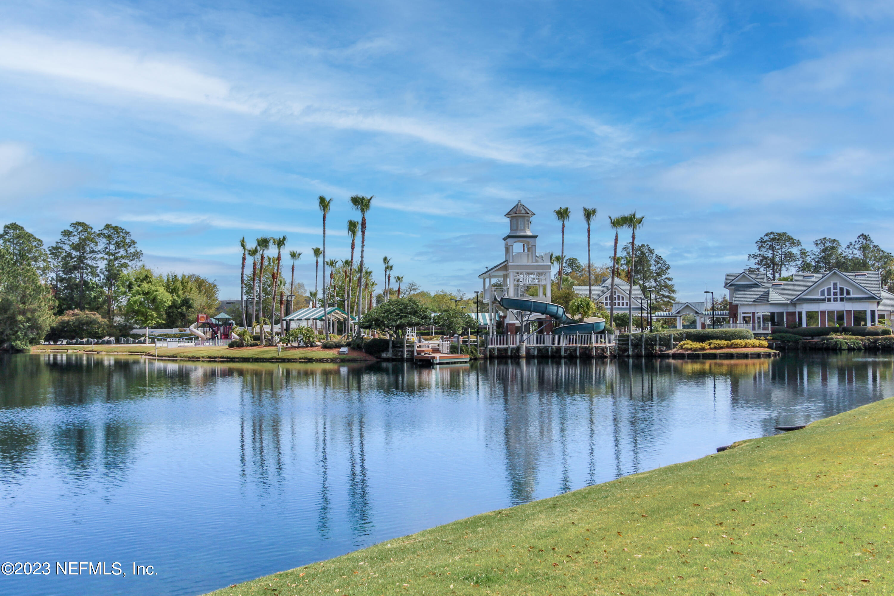 1614 Pinecrest Drive Fleming Island, FL 32003 - Photo 75 of 86 a view of a lake with boats and trees in the background