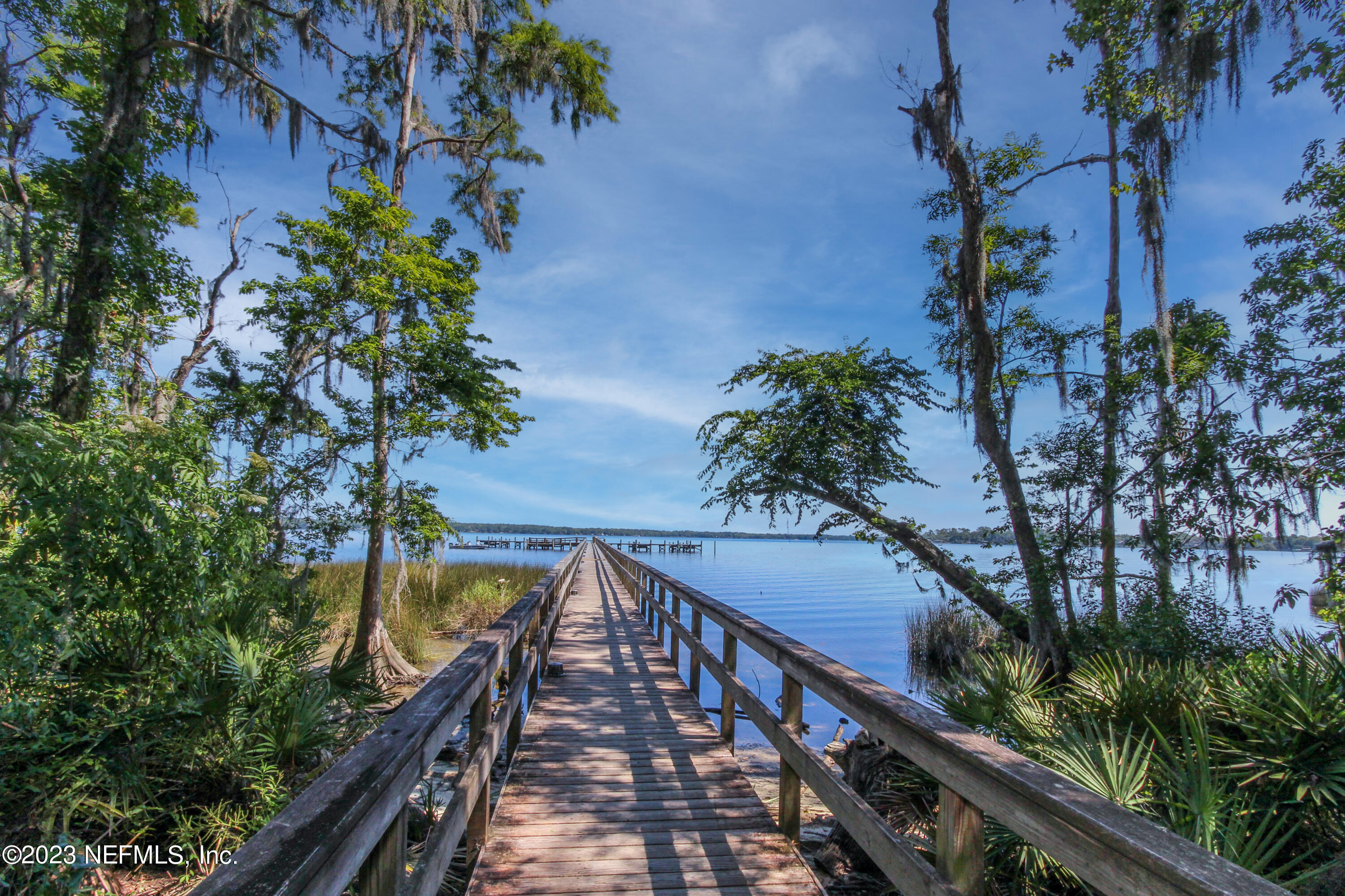 1614 Pinecrest Drive Fleming Island, FL 32003 - Photo 77 of 86 a view of a balcony with wooden floor and fence