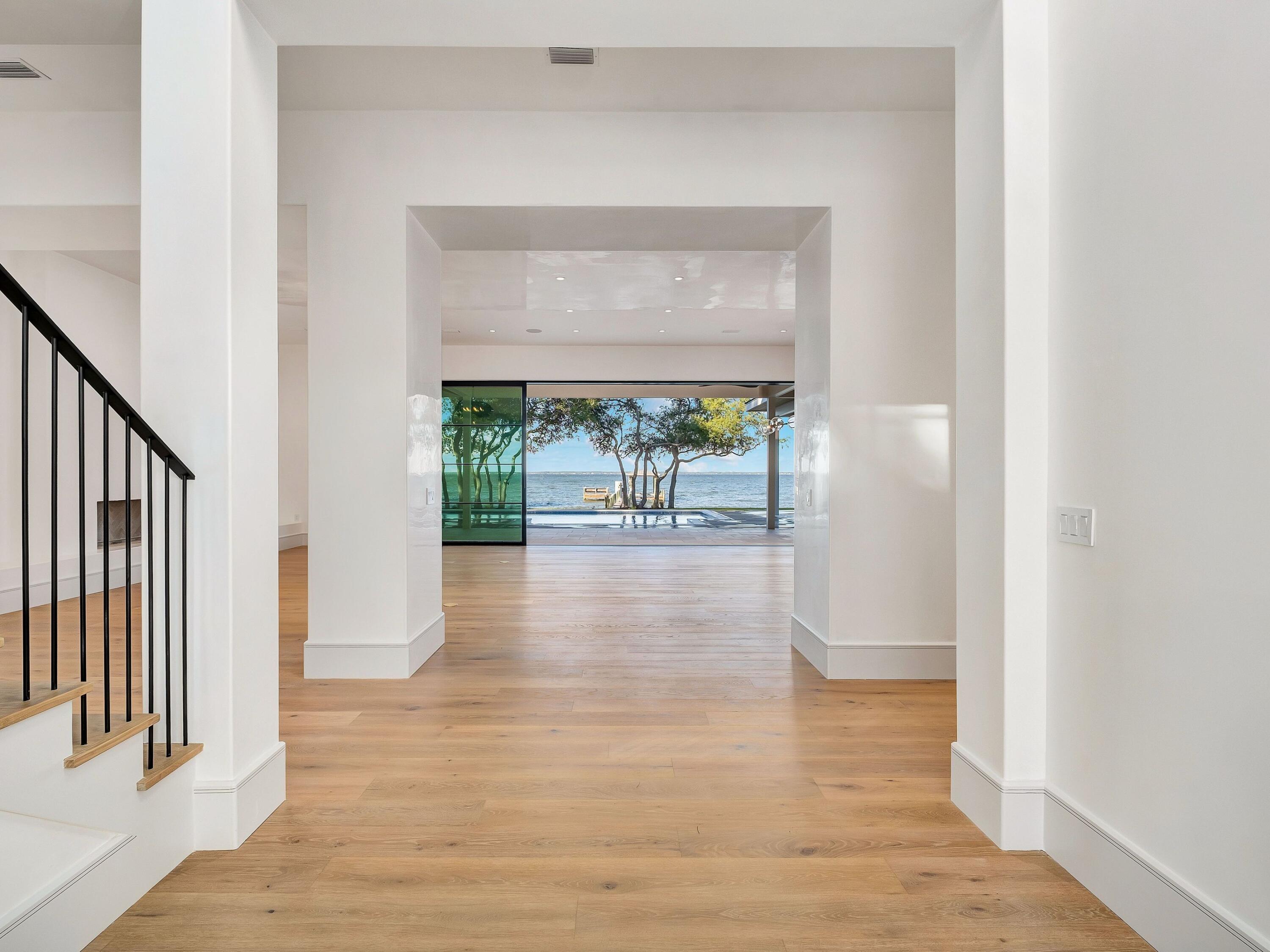 431 Pisces Drive Santa Rosa Beach, FL 32459 - Photo 11 of 48 a view of hallway with wooden floor and a rug