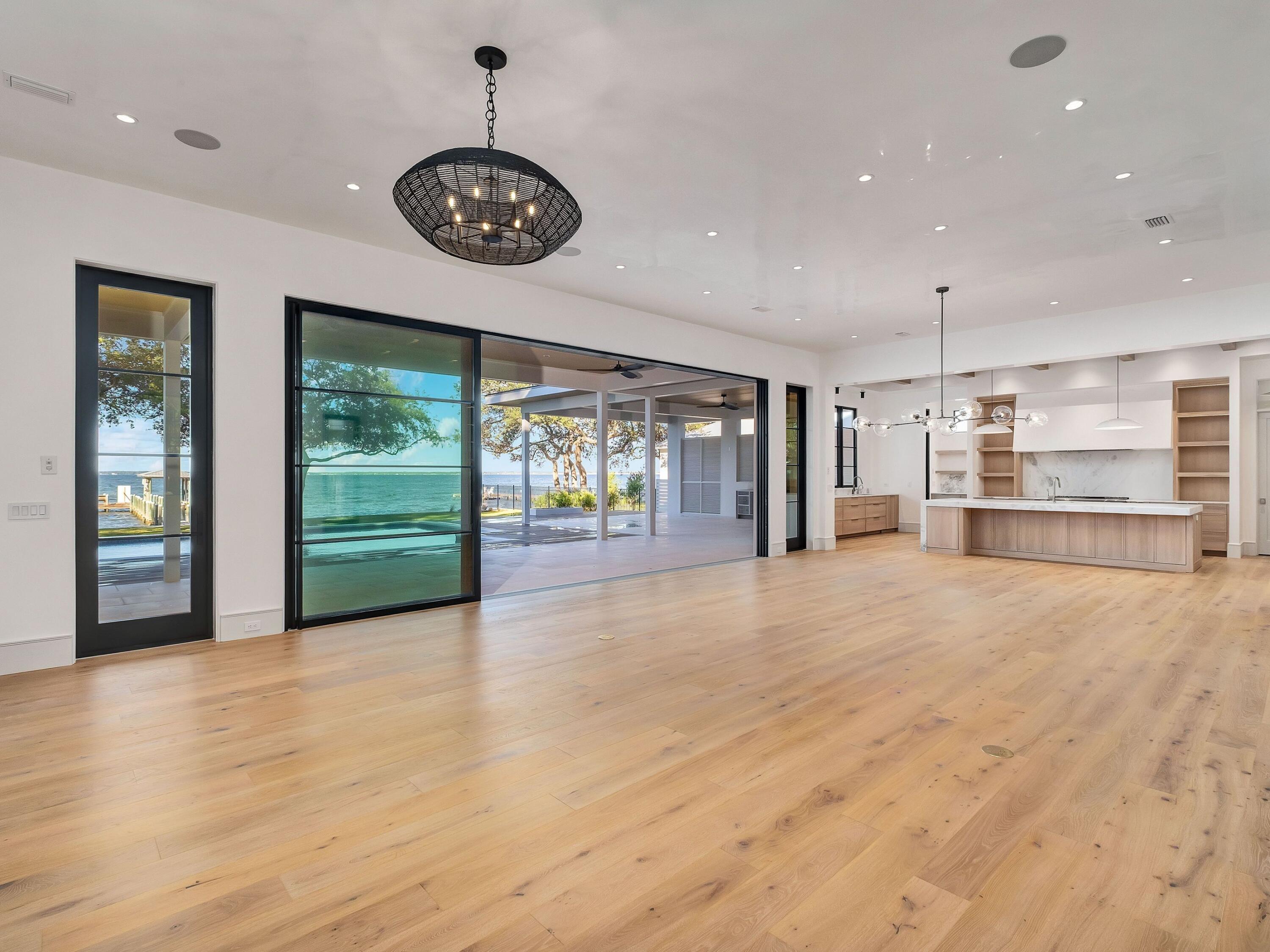431 Pisces Drive Santa Rosa Beach, FL 32459 - Photo 14 of 48 a view of an empty room with a window and a kitchen