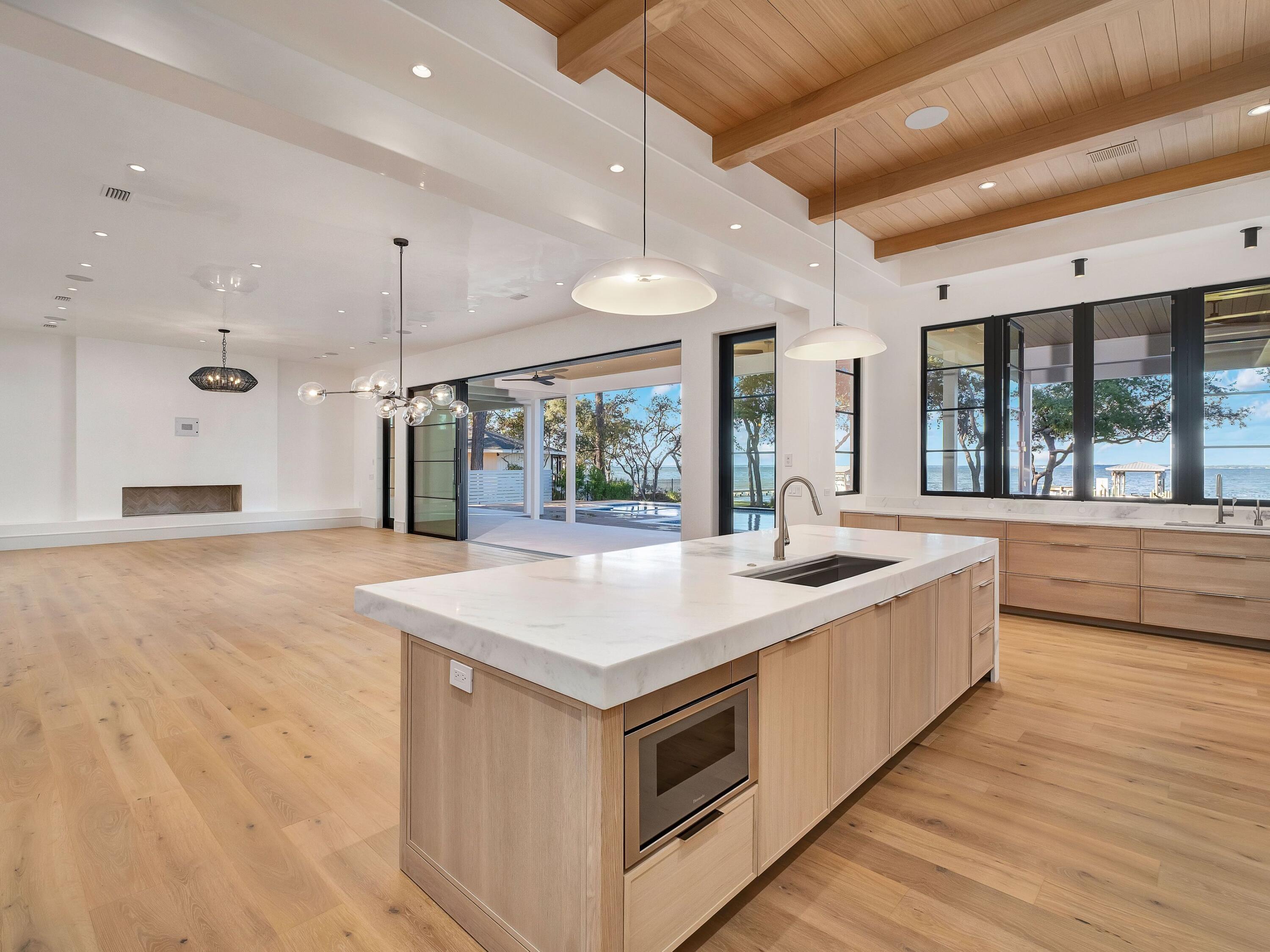 431 Pisces Drive Santa Rosa Beach, FL 32459 - Photo 19 of 48 a kitchen with a stove and a large window