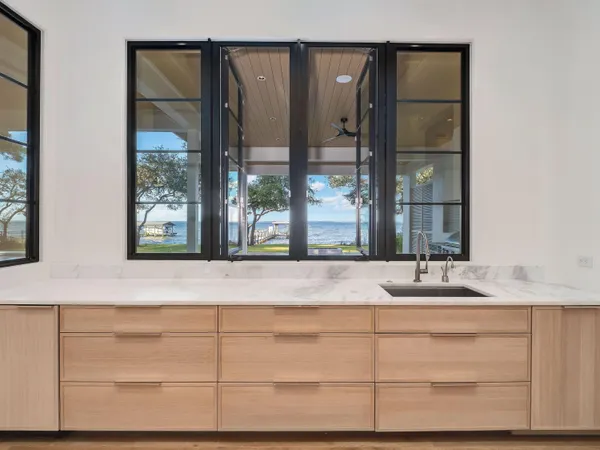 a bathroom with a sink and a large mirror