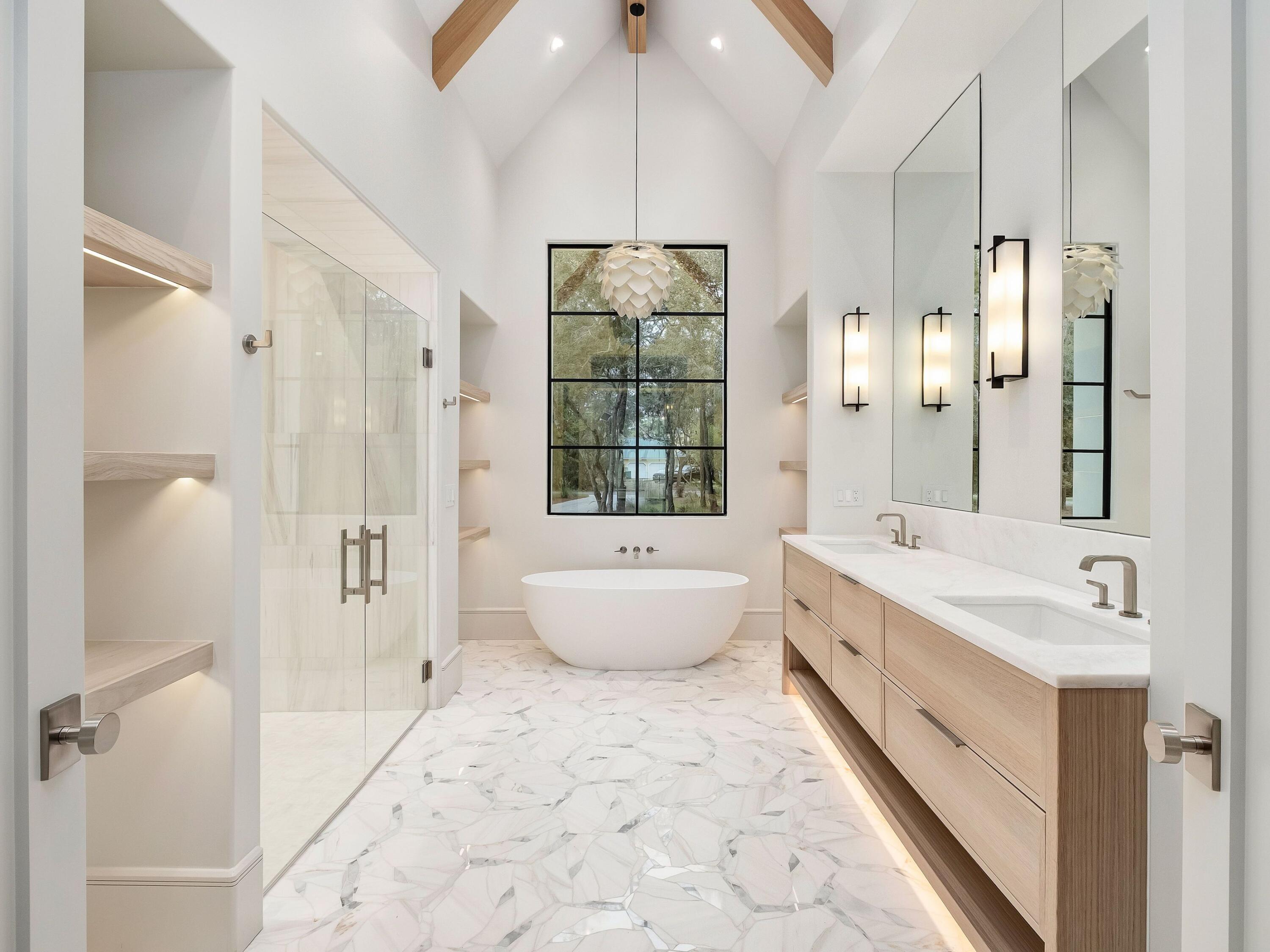 431 Pisces Drive Santa Rosa Beach, FL 32459 - Photo 26 of 48 a bathroom with a bathtub a sink and a large mirror