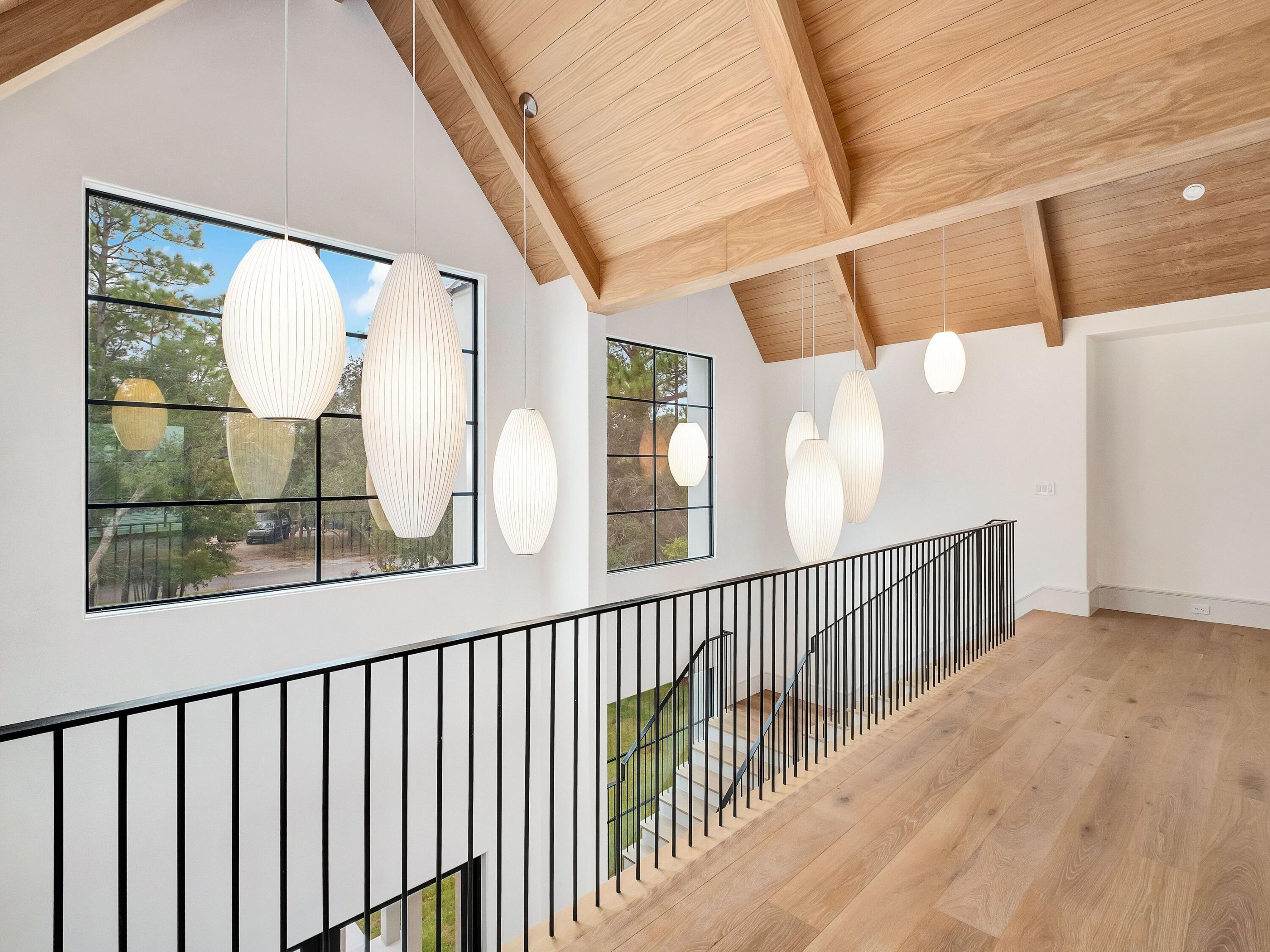 431 Pisces Drive Santa Rosa Beach, FL 32459 - Photo 39 of 48 a view of staircase with railing and wooden floor