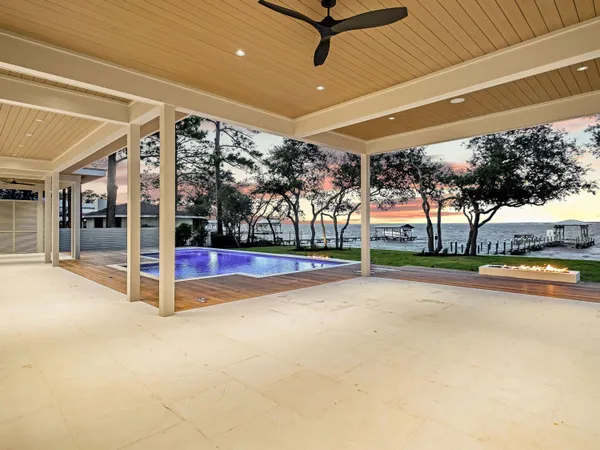 a view of a swimming pool with a patio