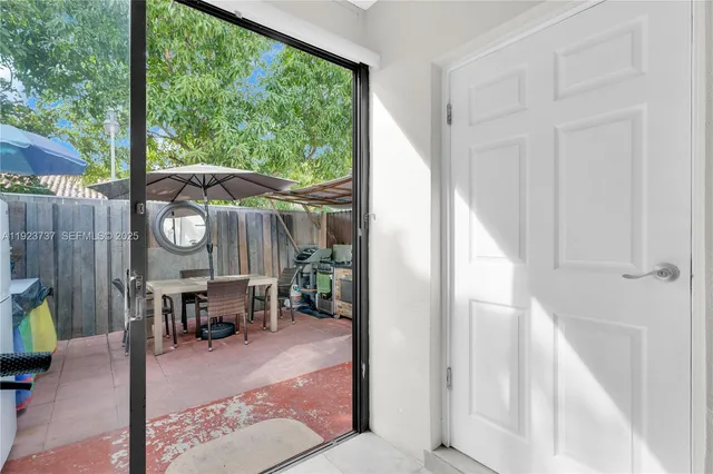 a view of a dinning room with furniture window and outside view