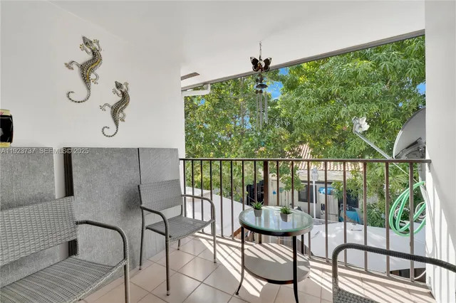 a view of a balcony with chairs