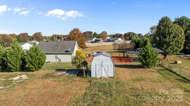 a view of a house with a yard and balcony