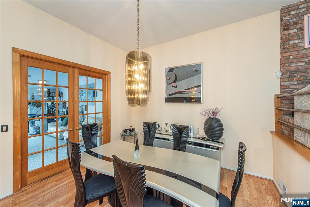 12 Abbott Road Wayne, NJ 07470 - Photo 6 of 49 a view of a dining room with furniture window and wooden floor