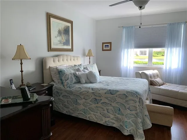 a bed room with a bed window and a night stand