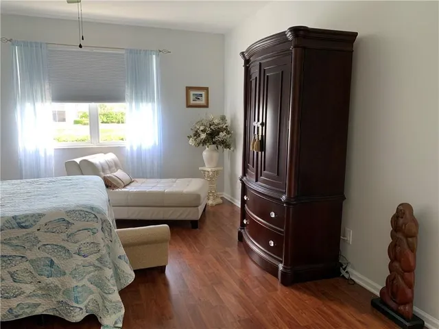 a bedroom with a bed and a dresser