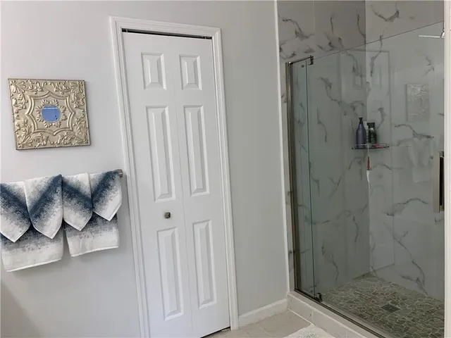 a bathroom with a bathtub and shower