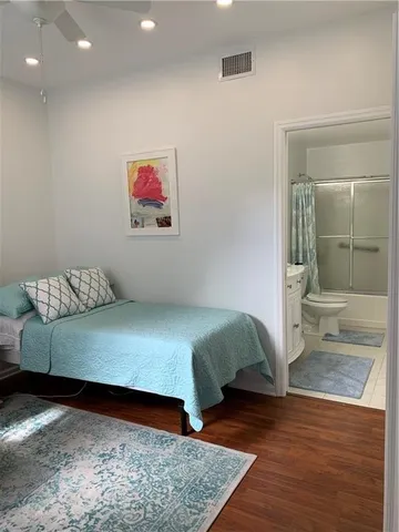a bedroom with a bed and bathroom