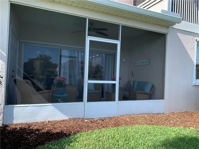 a view of house with backyard