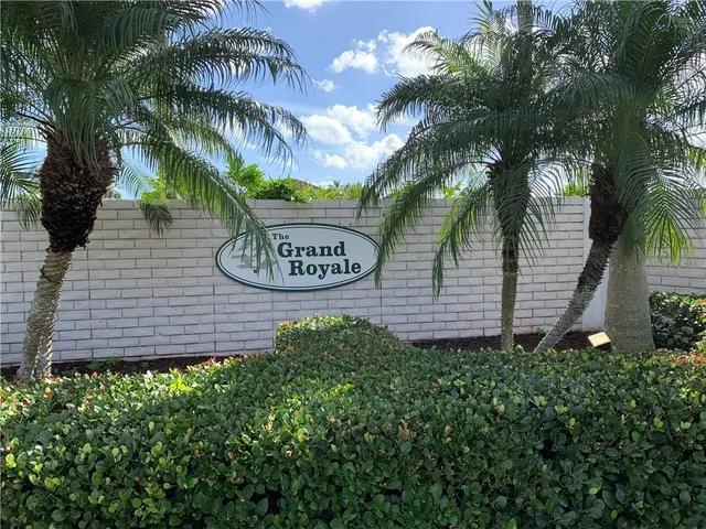 a sign that is sitting in front of a house