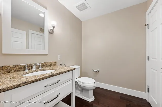 a view of entryway with wooden floor