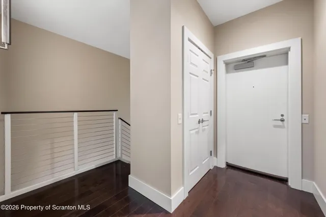 a view of balcony with wooden floor