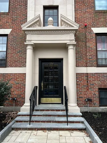 a front view of a house with stairs
