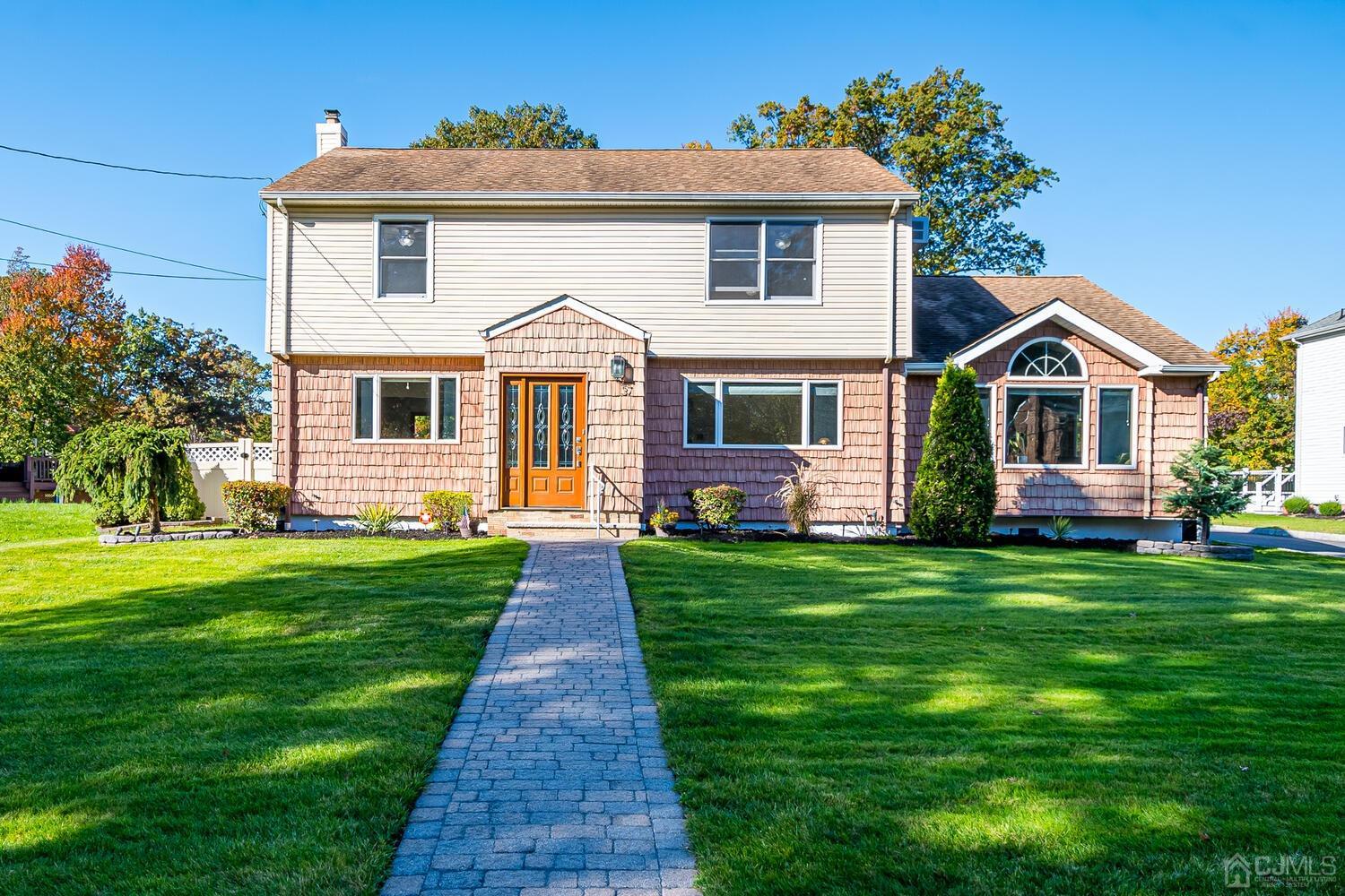 37 Utica Road Edison, NJ 08820 - Photo 1 of 53 a front view of a house with a garden