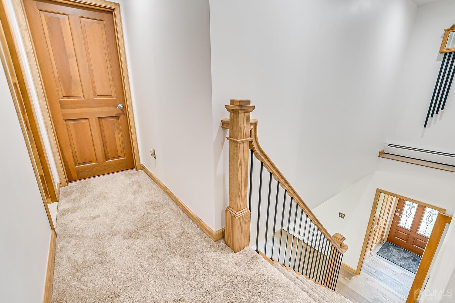 37 Utica Road Edison, NJ 08820 - Photo 41 of 53 a view of a hallway with wooden floor and staircase