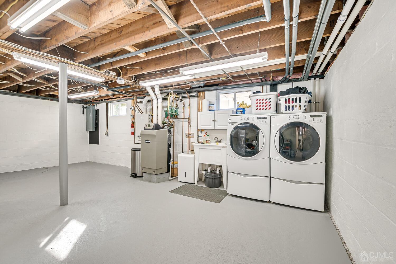 37 Utica Road Edison, NJ 08820 - Photo 45 of 53 a utility room with dryer and washer