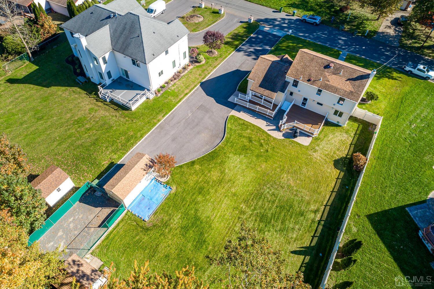 37 Utica Road Edison, NJ 08820 - Photo 50 of 53 an aerial view of a house with a garden and swimming pool